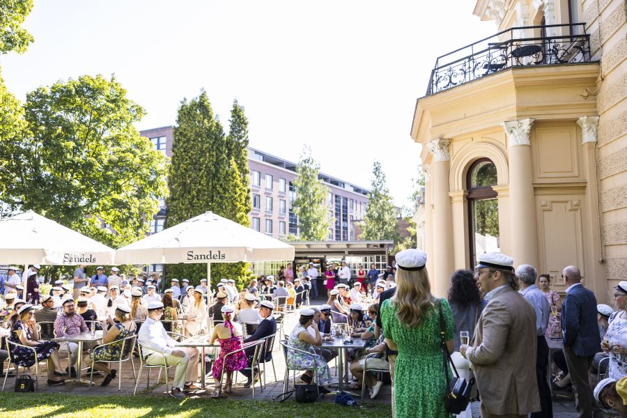 People are gathered at a garden party
