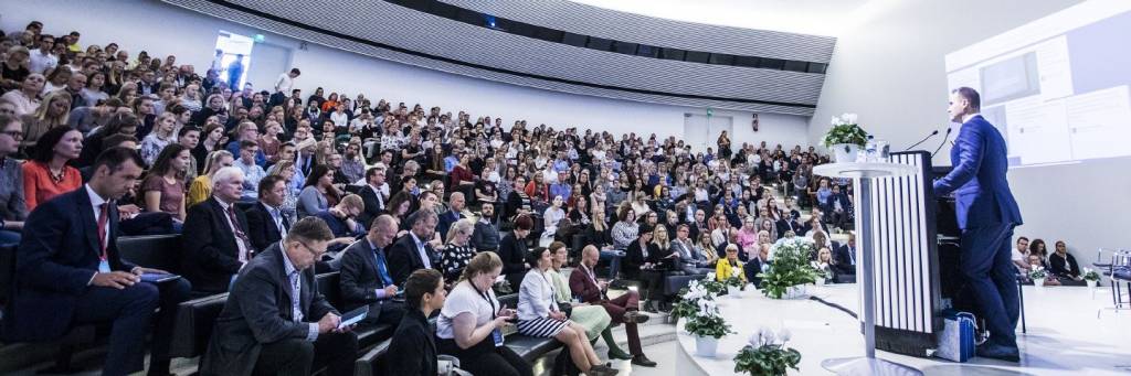 University Main Hall filled with audience.