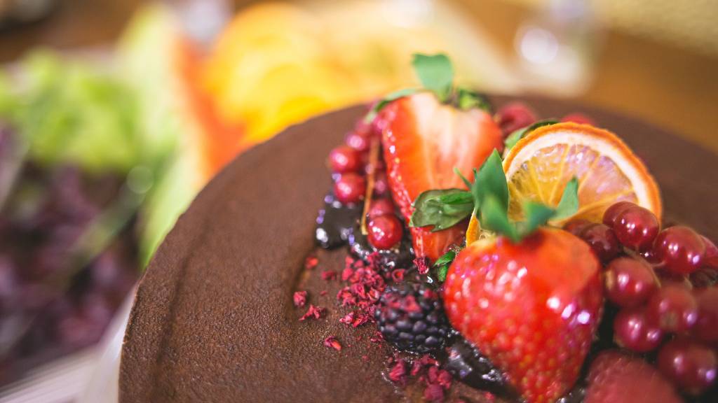 Chocolate cake with berries on the top.